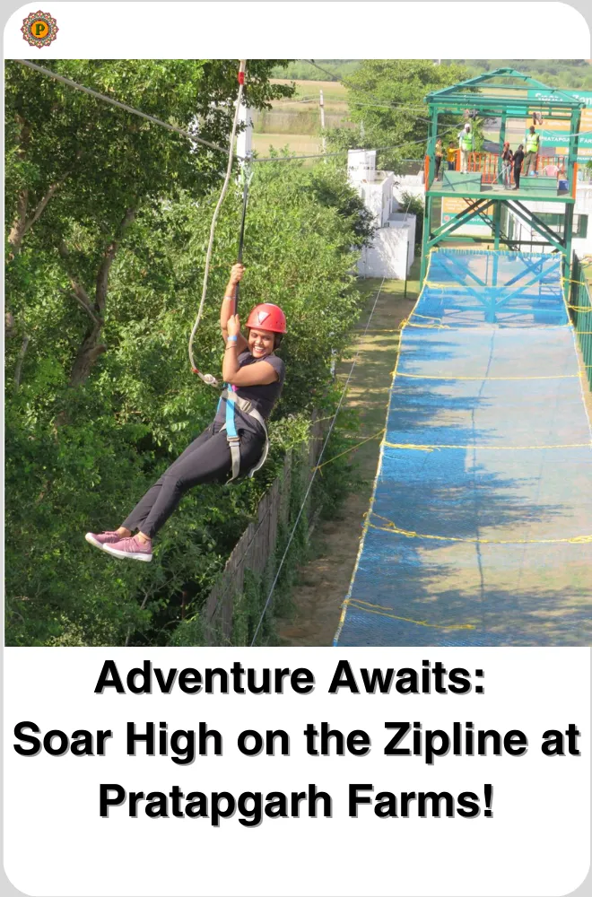 Woman in a red helmet riding a zipline beside a green tower