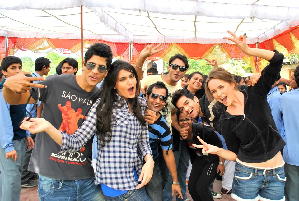 A group of colleagues cheering together at the farm